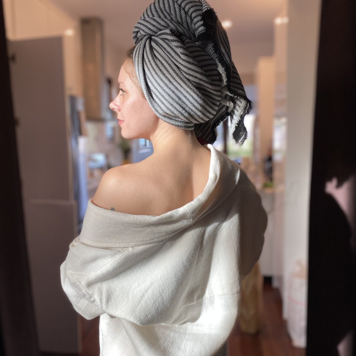 Woman in wool and silk robe and wool and bamboo hair towel
