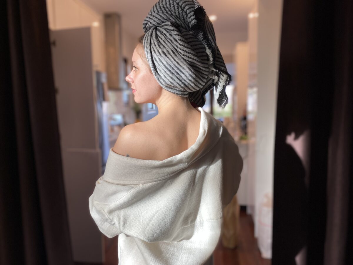 Woman in wool and silk robe and wool and bamboo hair towel